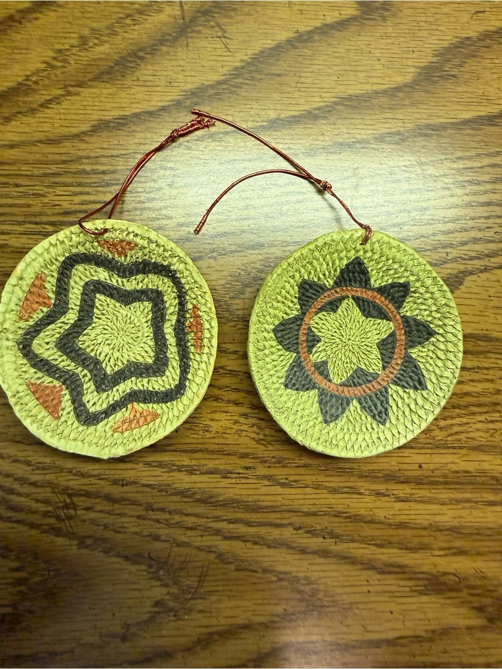 Handwoven Round Straw Ornaments with Star Motifs - Yellow, Black, Orange